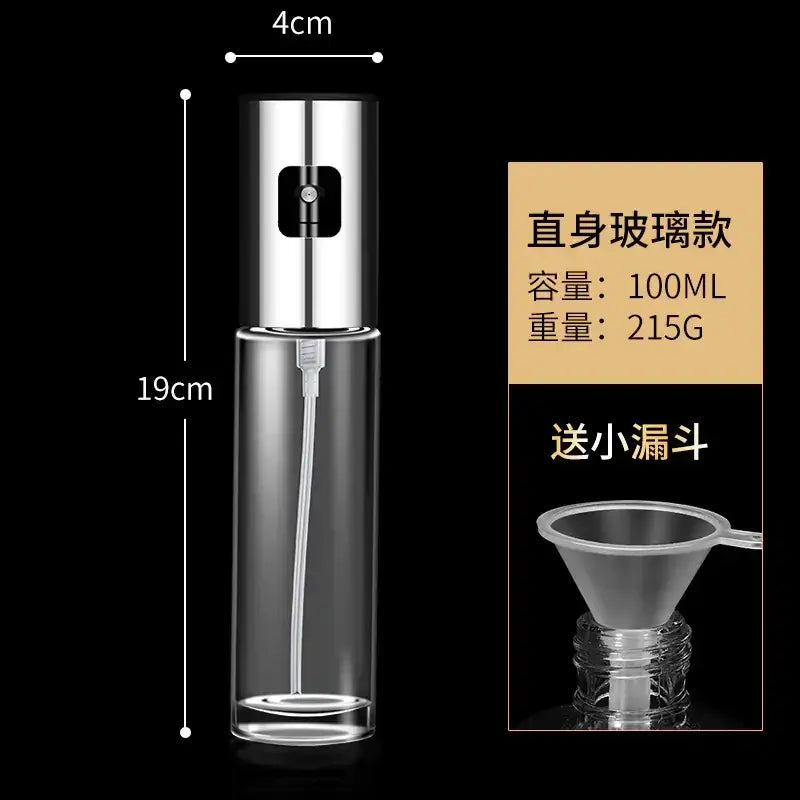 A sleek, transparent glass spray bottle with a polished chrome nozzle and trigger mechanism.