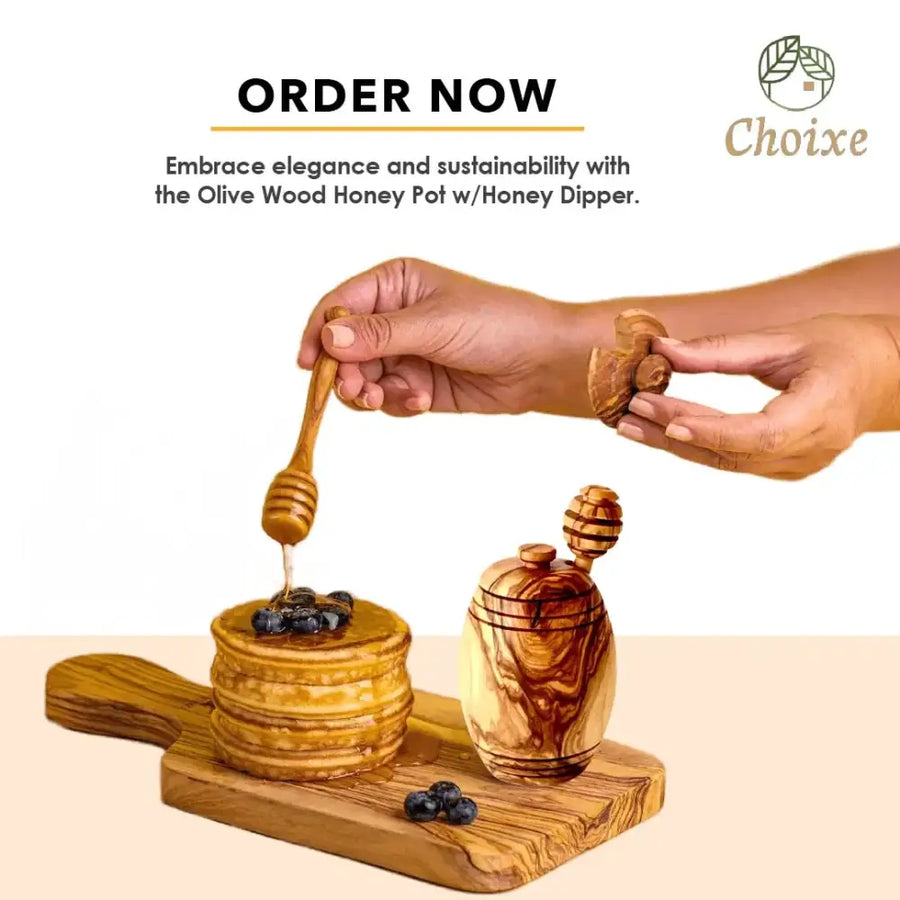 Olive wood honey pot with a matching dipper, featuring natural grain and warm brown tones.