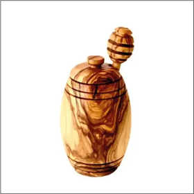Handcrafted olive wood honey jar with a natural, swirling grain pattern and a matching wooden dipper.