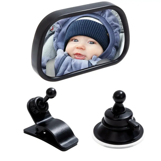 Black rectangular car side mirror with a reflective surface showing a baby in blue clothing, accompanied by two black mounting accessories: one clip and one suction cup.