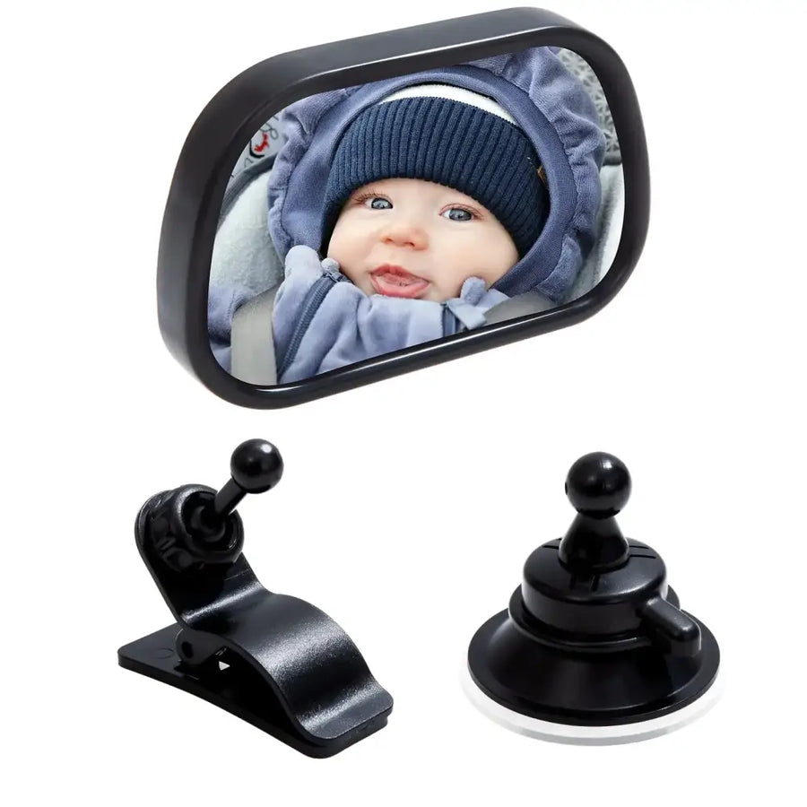 Black rectangular car side mirror with a reflective surface showing a baby in blue clothing, accompanied by two black mounting accessories: one clip and one suction cup.
