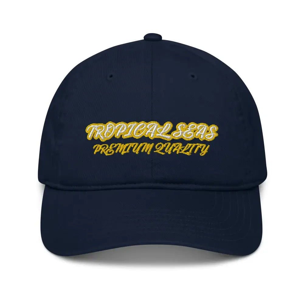 Navy blue dad hat with gold and white embroidered ’tropical seas premium quality’ text.