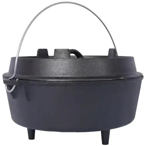 Black cast iron dutch oven with a sturdy wire handle and three short legs.
