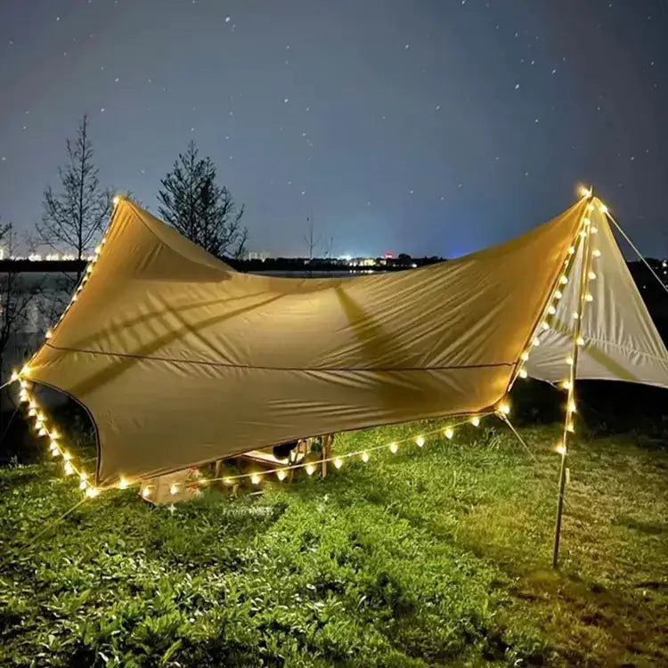 Beige canvas tarp with string lights.
