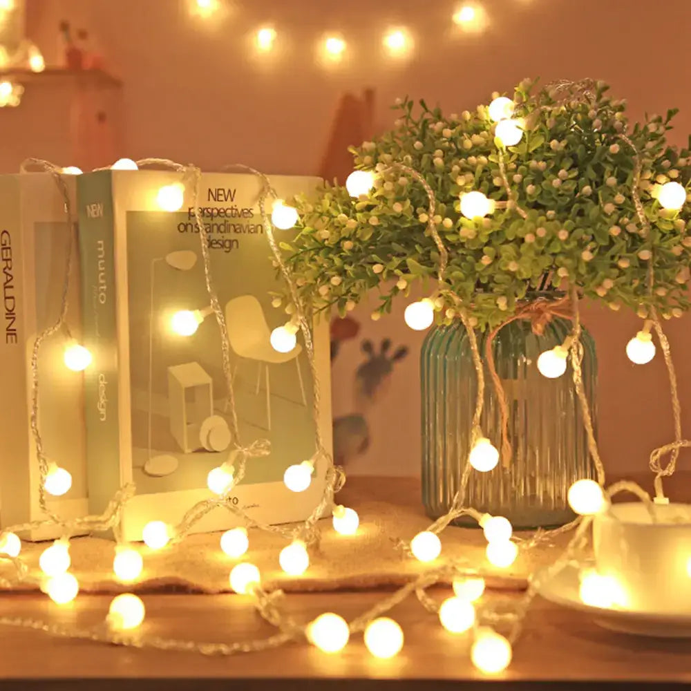 Warm white led string lights with a delicate, twisted wire design.