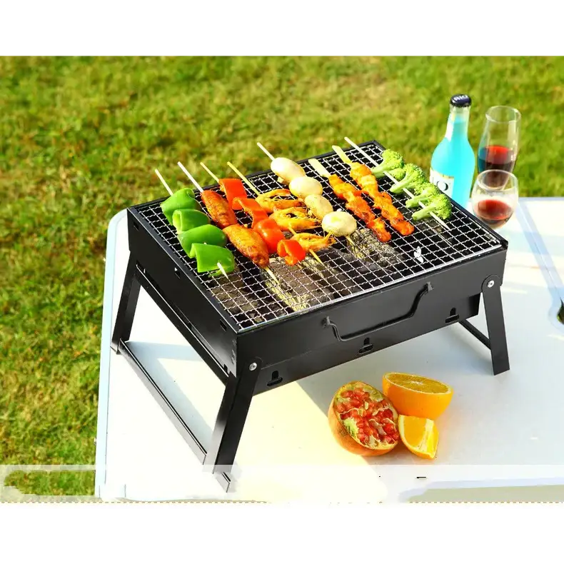 Black metal folding grill with a grid cooking surface and side handles
