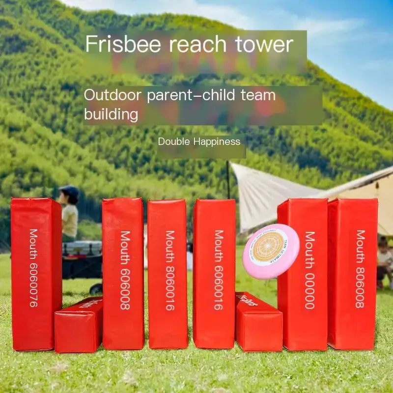 Pink frisbee resting atop a red rectangular block in an outdoor setting.