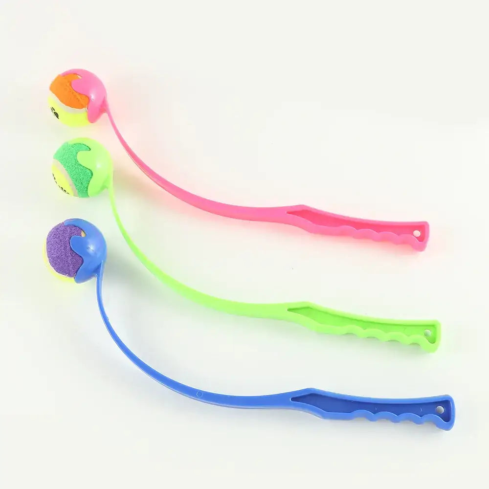 Three colorful, flexible plastic cat toys with textured balls and ergonomic handles in pink, green, and blue.