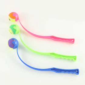 Three colorful, flexible plastic cat toys with textured balls and ergonomic handles in pink, green, and blue.