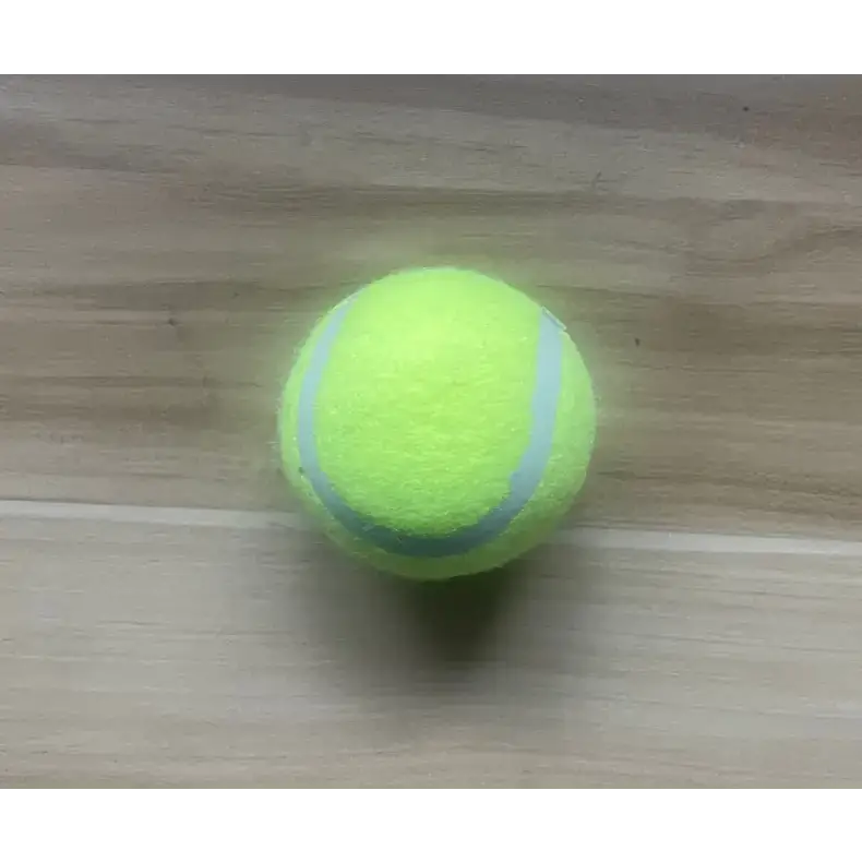 A bright yellow tennis ball with two light gray curved stripes.