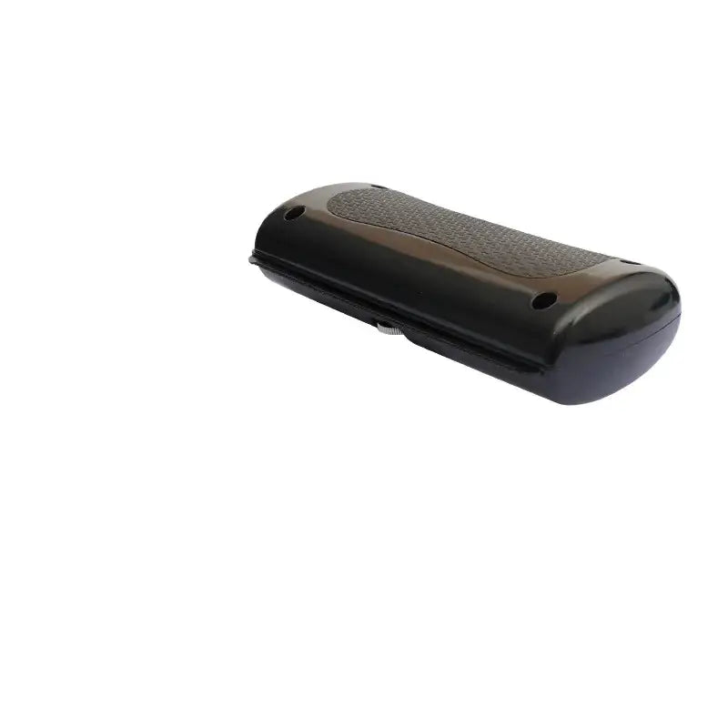 Black plastic eyeglass case with textured grip surface and rounded edges.