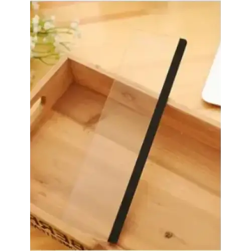 Black rectangular phone stand resting on a wooden surface.