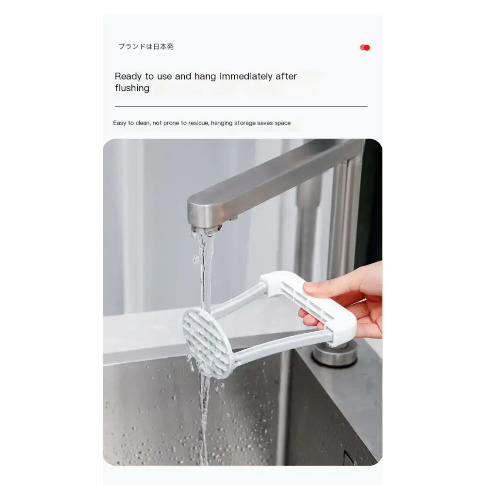 White plastic potato masher with a grid-like head and ergonomic handle, designed for easy cleaning and hanging storage
