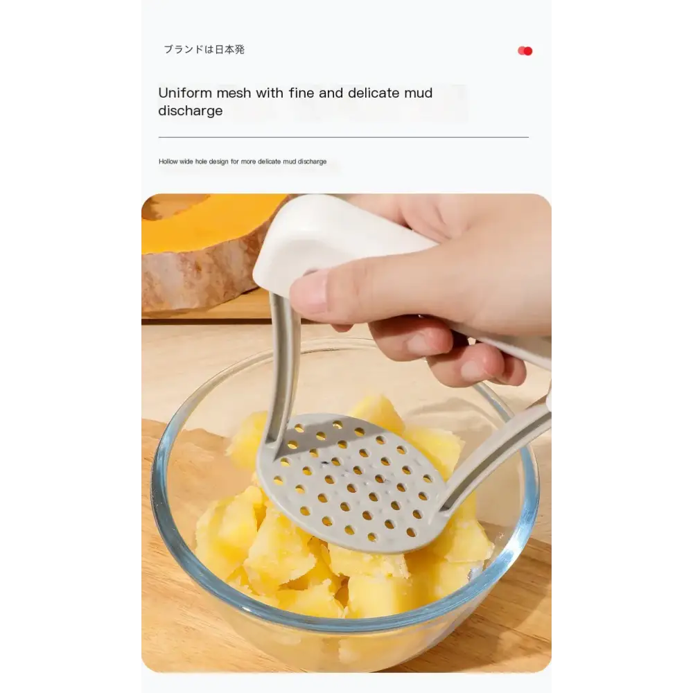 White-handled stainless steel potato masher with a uniform mesh head featuring fine, delicate holes for efficient mud discharge.