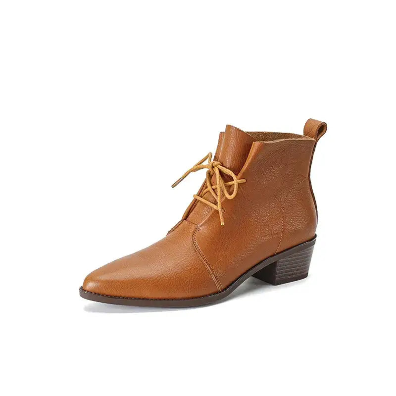 Tan leather ankle boot with a pointed toe and low block heel, featuring light tan laces.