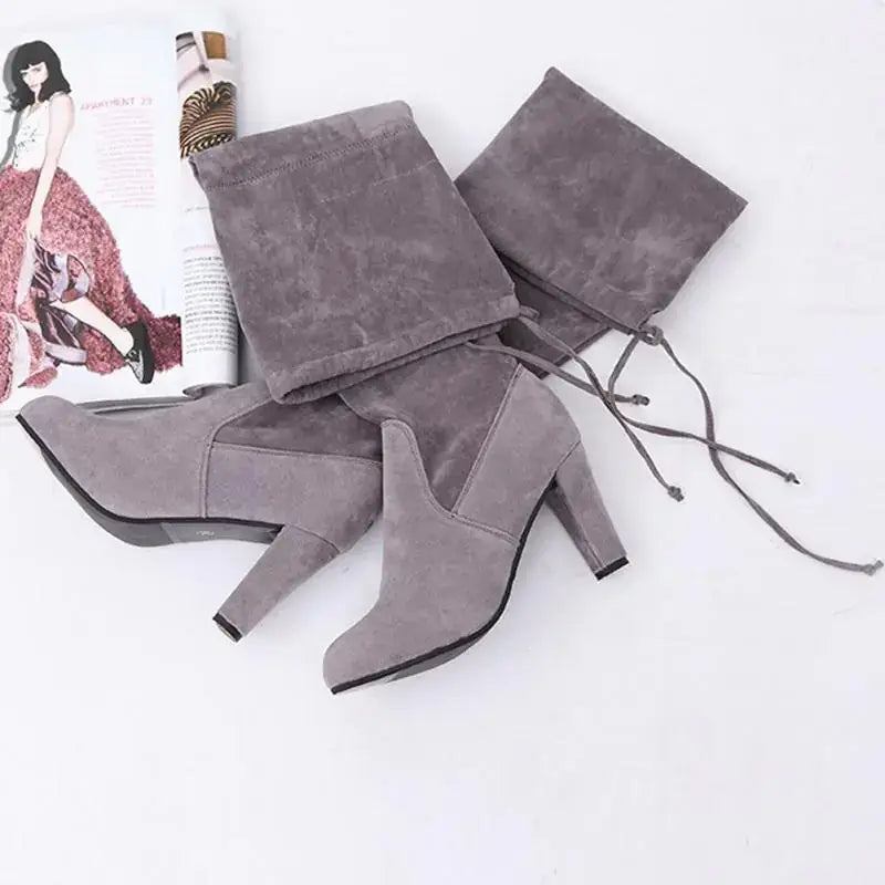 Gray suede over-the-knee boots with a block heel and drawstring tie.