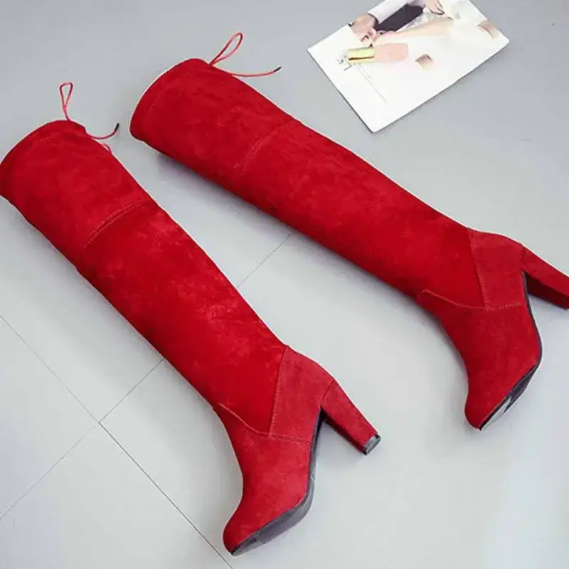 Red suede over-the-knee boots with a block heel and adjustable drawstrings.