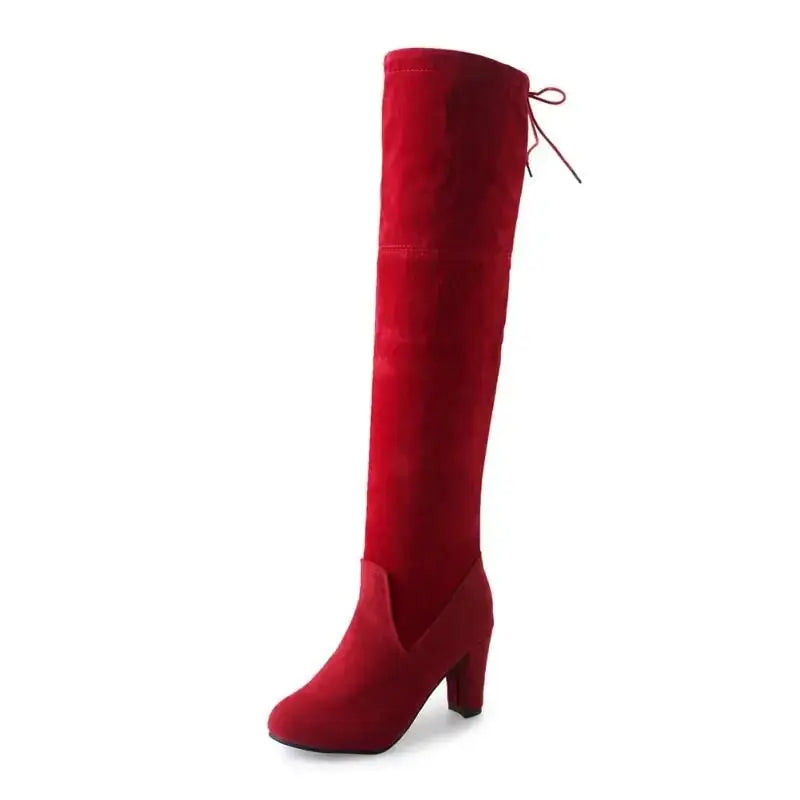 Red suede over-the-knee boot with a block heel and lace-up back.