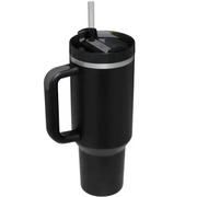 Black insulated travel mug with a sturdy handle, silver rim accents, and a clear straw inserted into its lid.