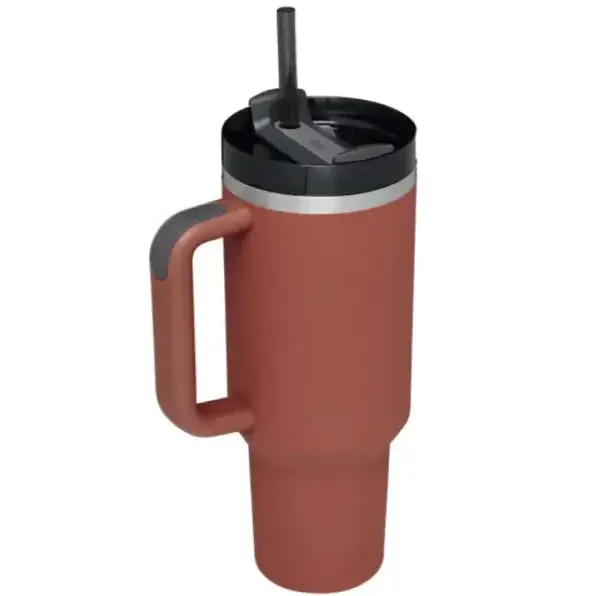 Terracotta-colored insulated travel mug with a black lid and gray handle, featuring a sleek metallic rim.