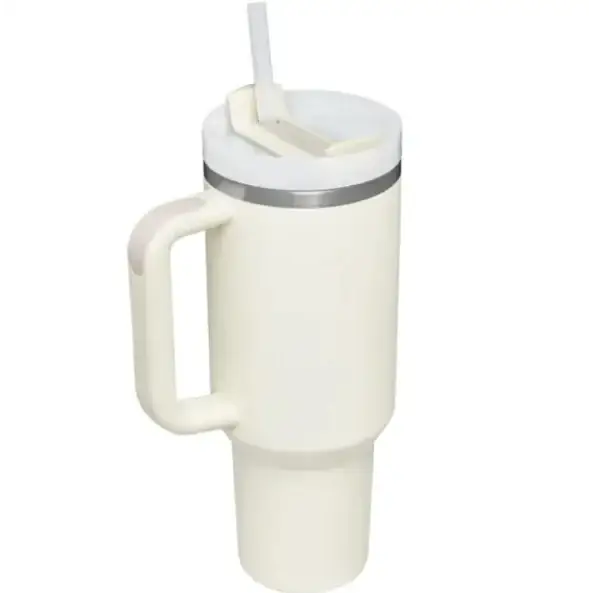 Cream-colored insulated travel mug with a silver rim, integrated handle, and white straw lid.