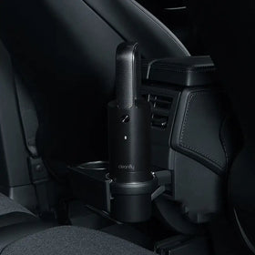 Black carbon-fiber-textured handheld car vacuum with ’cleanfly’ branding