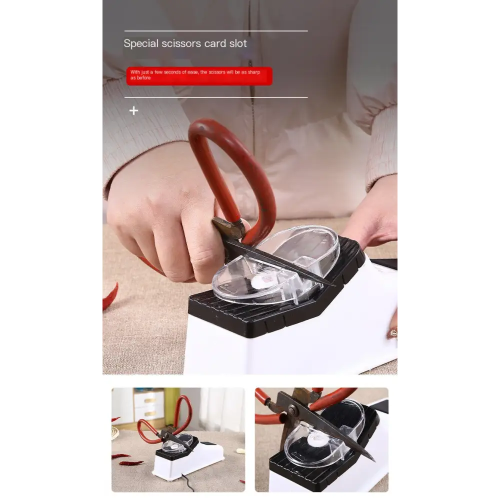 Red-handled scissors resting in a black and white electric sharpener with a clear plastic guide.