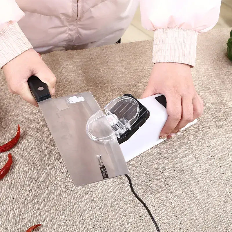 White and black electric knife sharpener with transparent protective cover