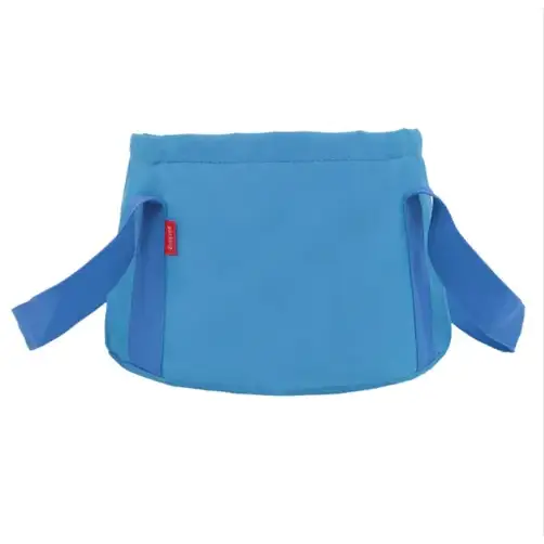 Blue fabric baby carrier with adjustable straps and a small red brand tag.