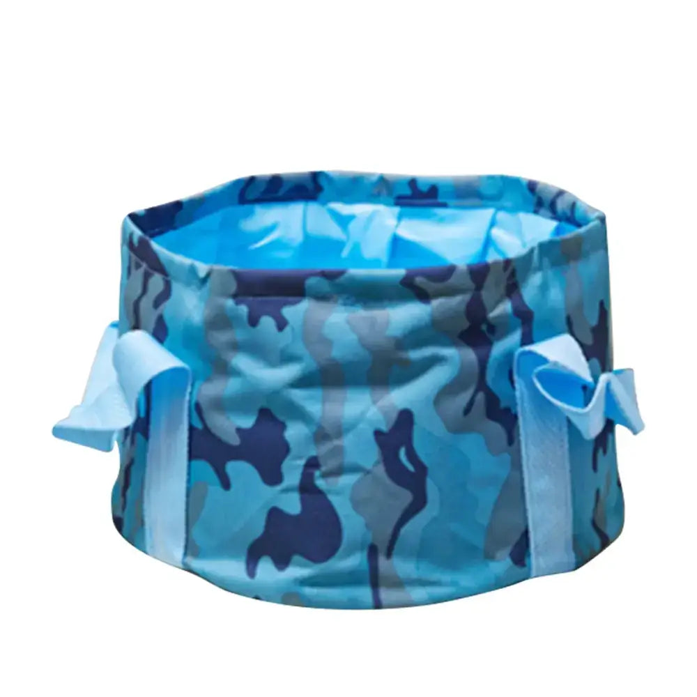 Blue and gray camouflage-patterned collapsible wash basin with light blue fabric ties.