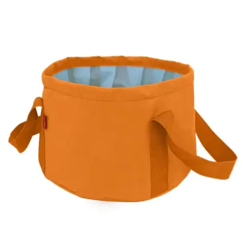 Orange collapsible fabric basin with light blue interior lining and sturdy handles.
