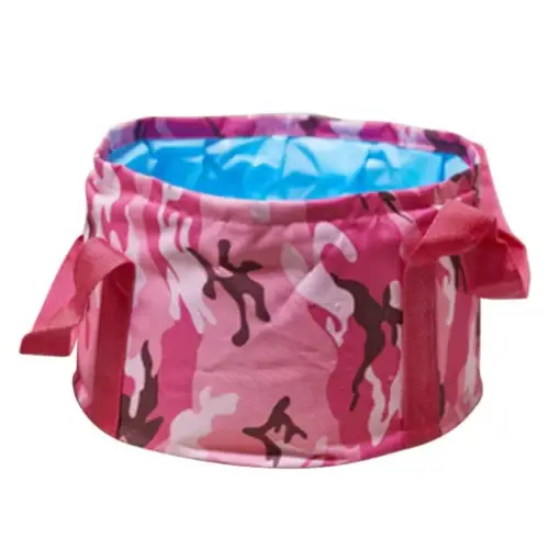 Pink camouflage-patterned collapsible wash basin with a blue interior lining and fabric handles.