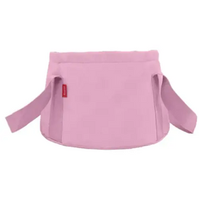Pink fabric baby carrier with adjustable straps and a small red brand tag.