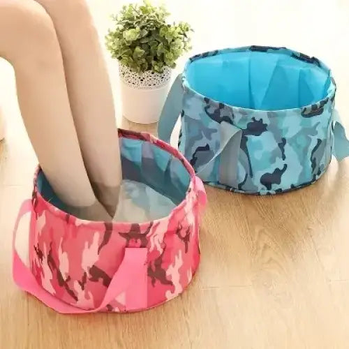 Pink and red camouflage-patterned collapsible foot bath with blue interior lining.
