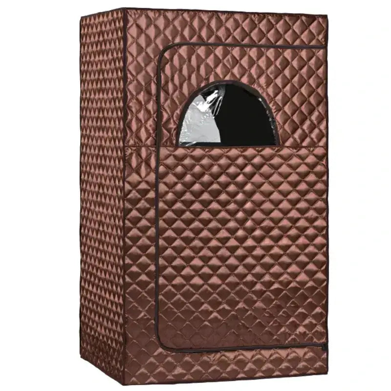 Brown quilted fabric sauna tent with a clear arched window.