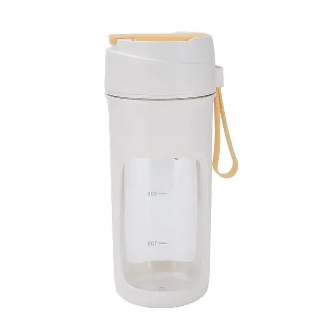 White and beige travel blender with a clear body, white lid, and carrying strap