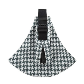 Black and white houndstooth patterned fabric pet carrier with adjustable black strap.