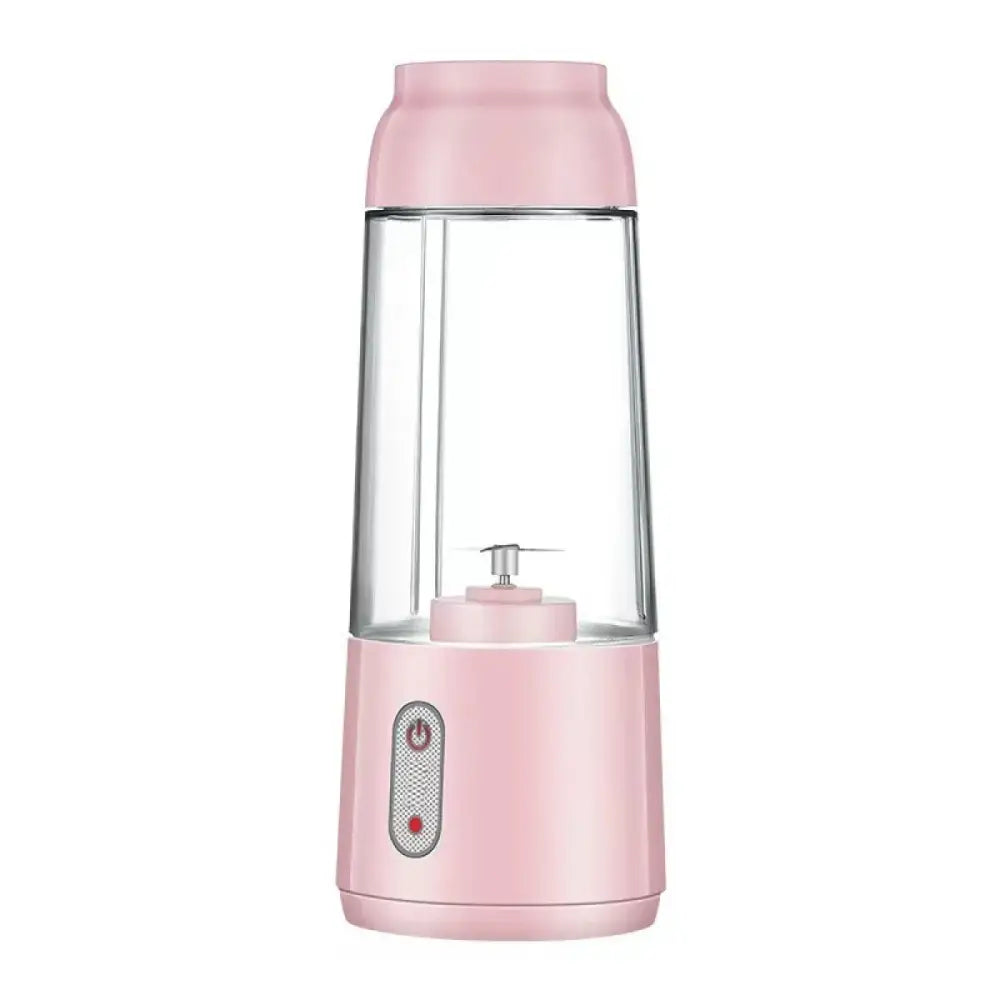 Pink portable blender with a clear glass container and metallic blades.