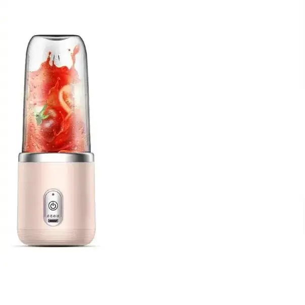 Pink and silver portable blender with a clear glass container filled with red fruit.