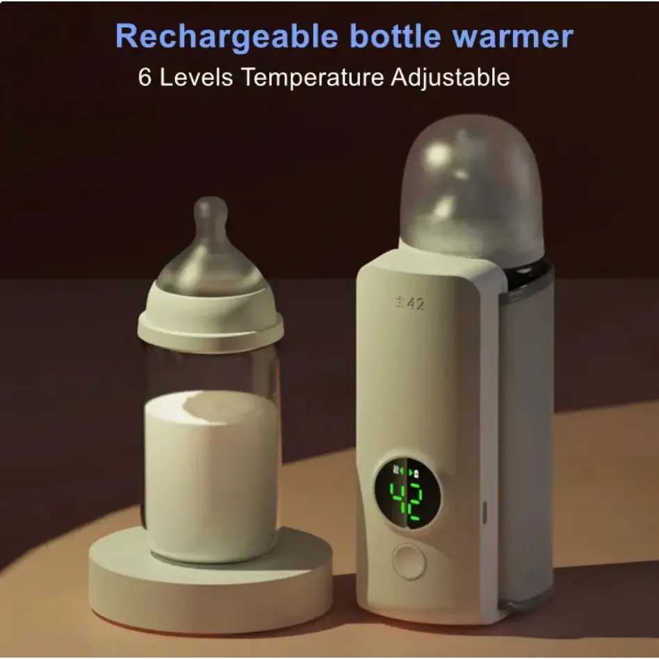 Cream-colored rechargeable bottle warmer with a digital display showing 42 degrees celsius, designed to gently warm baby bottles.