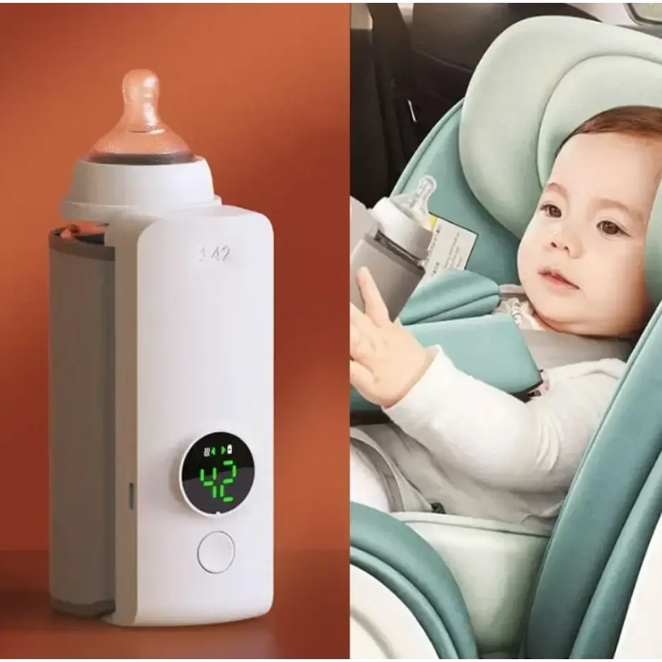 White digital baby bottle warmer with a circular green display showing 42 degrees and a gray side panel.