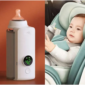 White digital baby bottle warmer with a circular green display showing 42 degrees and a gray side panel.