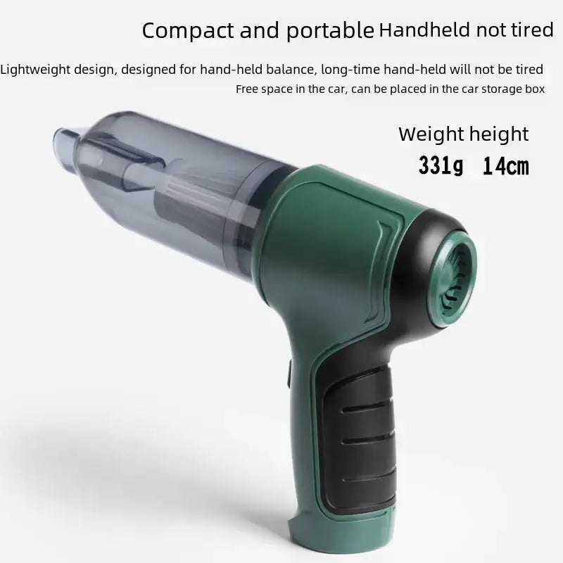 Compact handheld vacuum cleaner with a translucent gray body and green handle, featuring black grip accents.