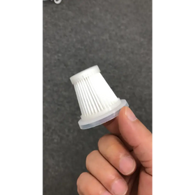 White plastic vacuum cleaner filter with a ribbed interior and translucent base.