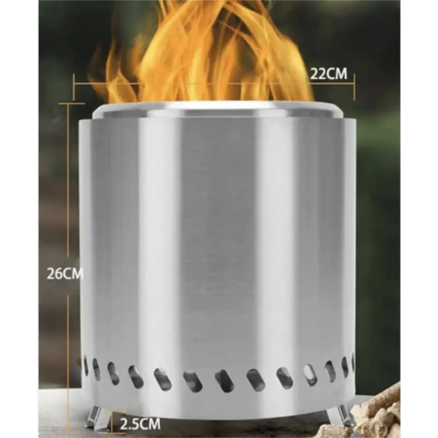 Silver stainless steel cylindrical portable campfire stove with flame burning inside.
