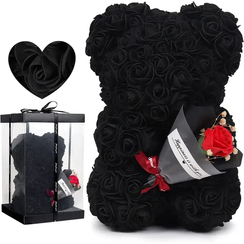 Black rose-covered teddy bear with a single red rose bouquet tucked into its side.