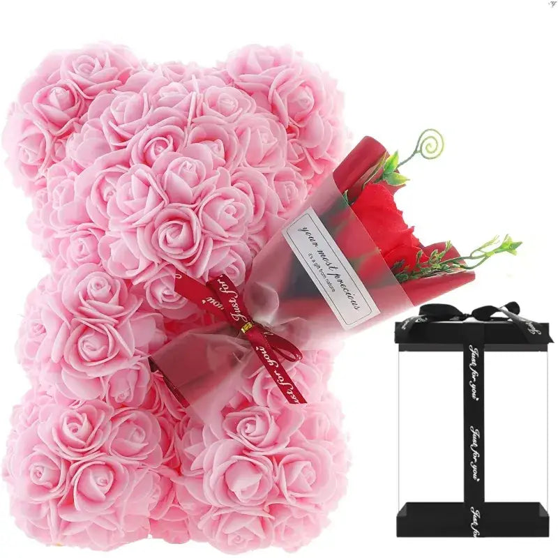 Pink rose-covered bear-shaped decorative item.