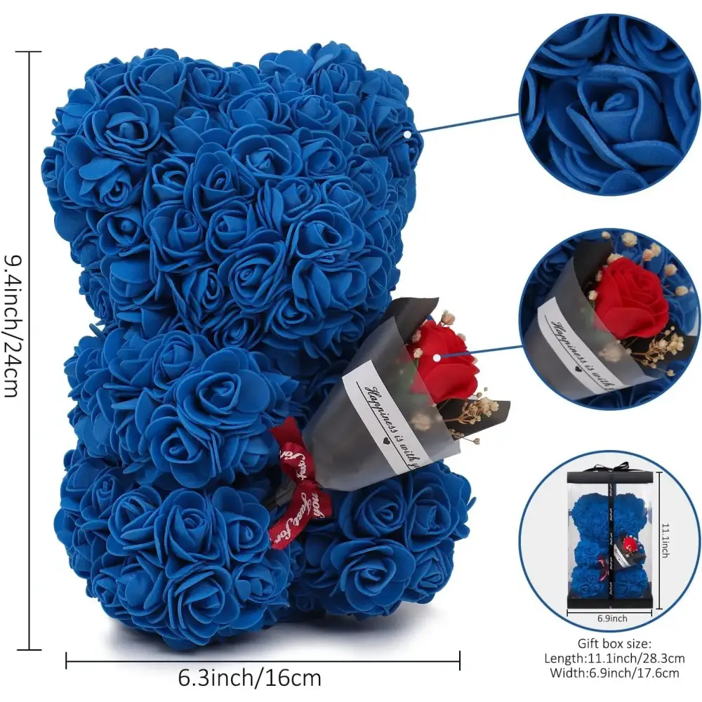 A plush blue rose-covered teddy bear with a red rose bouquet nestled in its arm.
