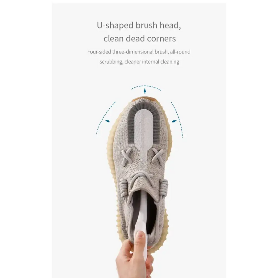 Gray u-shaped brush head designed for cleaning shoe interiors, featuring a soft bristle texture and ergonomic handle.