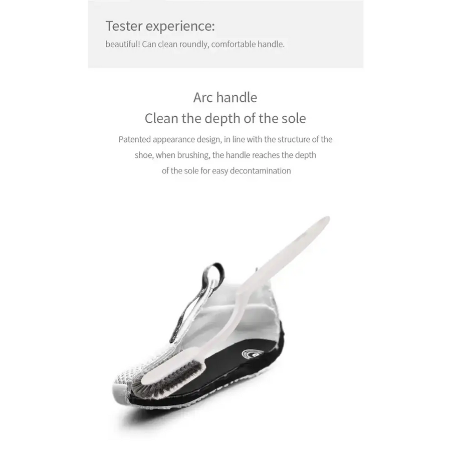 White arc handle shoe brush with black rubber base and bristles